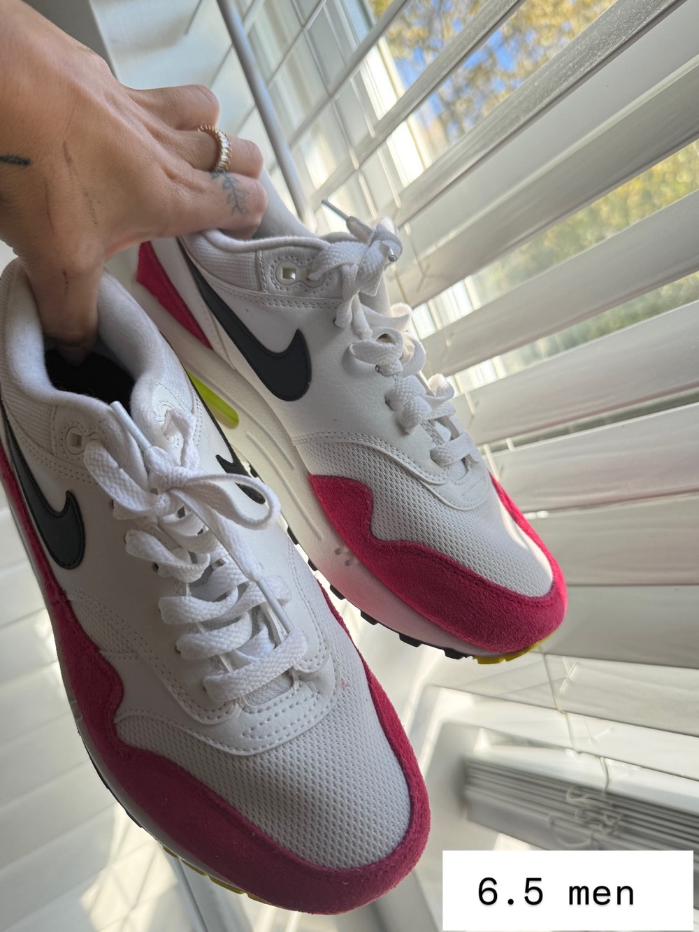 Nike Women’s White and Pink Low-Top Running Sneakers with Black Swoosh